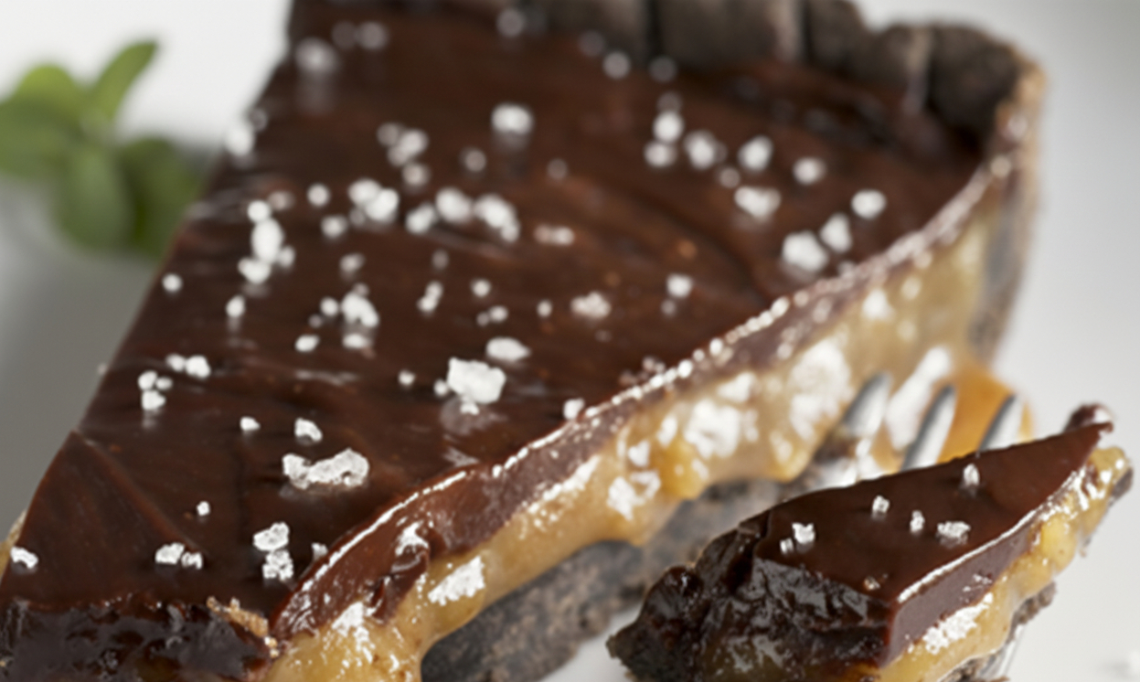 Upclose of a Dark Chocolate and Caramel Tart with Lavender Sea Salt